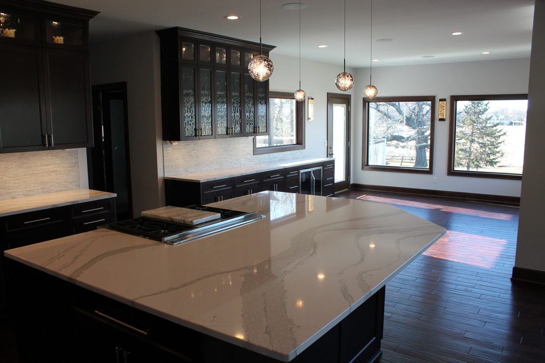 Kitchen island and counters facing the window wall