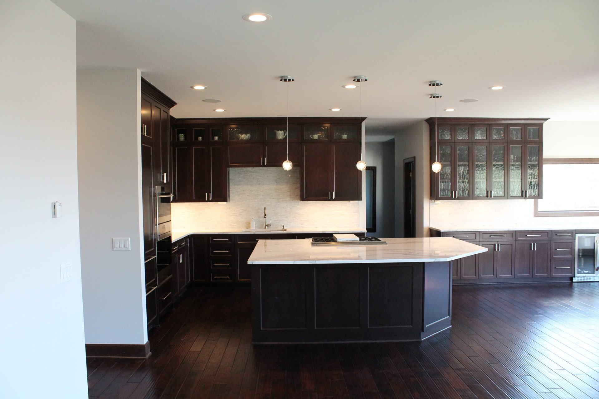 Custom kitchen and open living space built by ACE Design Build in the western Twin Cities
