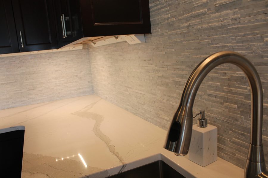 Quartz countertop and fixture detail in an ACE Design Build kitchen