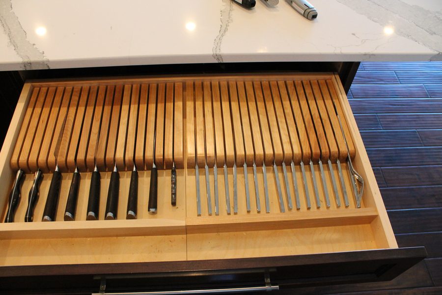 Custom pull-out millwork with fitted knife and utensil storage