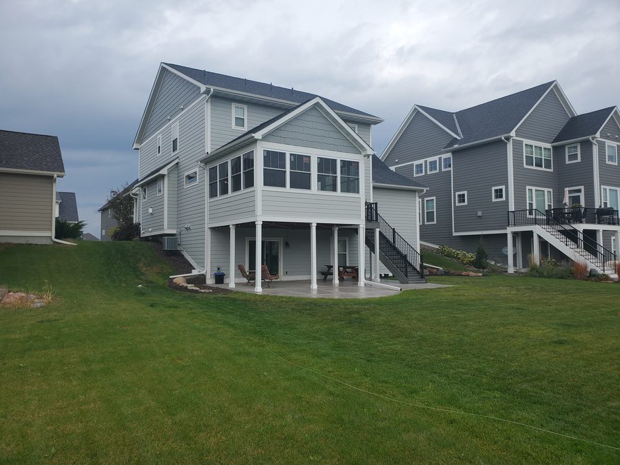 Walkout home exterior with multi-level deck built by ACE Design Build