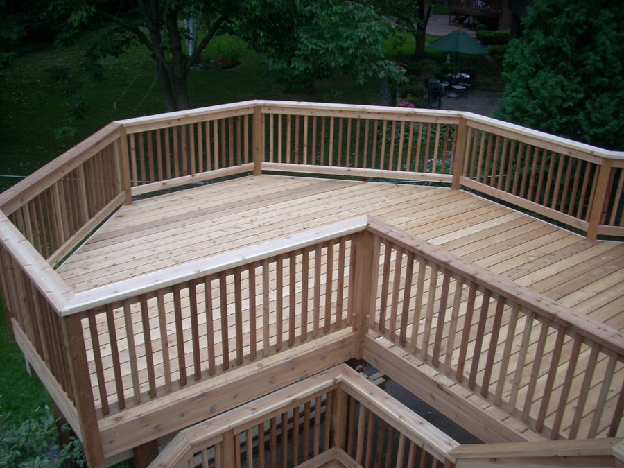 Custom cedar deck with built-in benches built by ACE Design Build