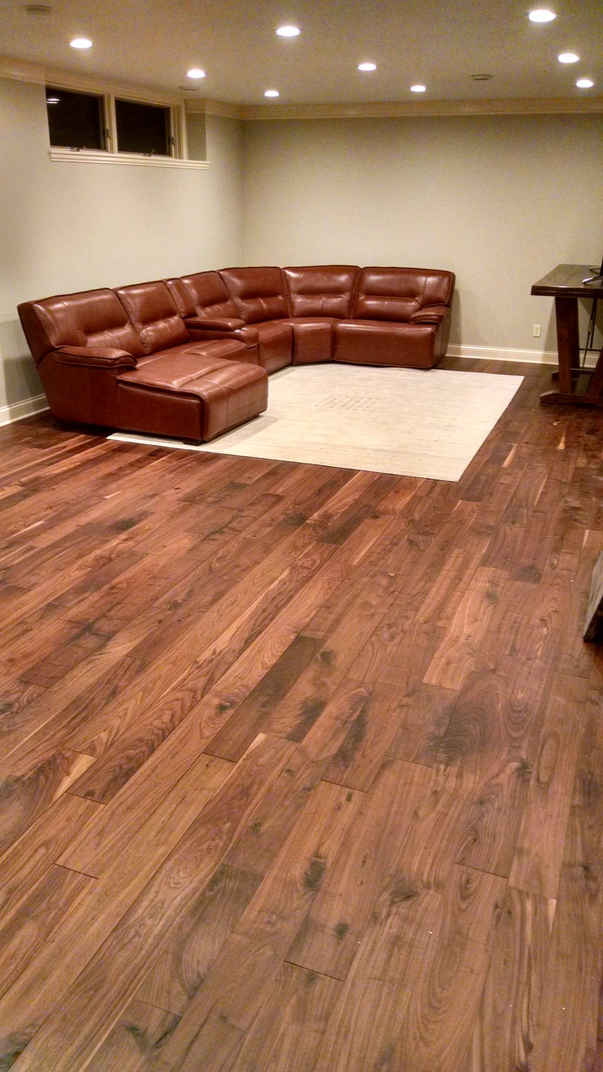 Finished basement living space with hardwood floors in Victoria